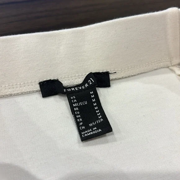 NWT Forever21 white bodycon mini skirt with peplum ruffle trim (M) - Picture 4 of 5
